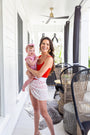 red square neck one-piece tank swimsuit with white belt and white sarong
