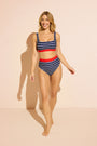 Model wearing navy and white striped DreamSculpt bikini top and bottom with tummy-control fit against a studio backdrop.